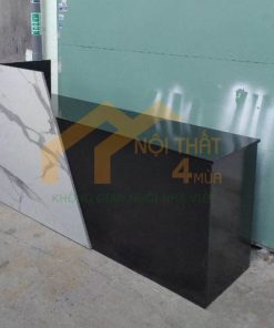 Quầy lễ tân đen phối vân đá hiện đại